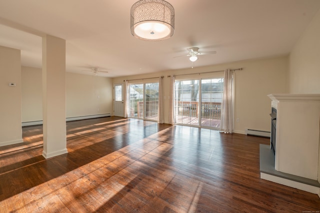 unfurnished living room featuring dark wood-type flooring, ceiling fan, and baseboard heating