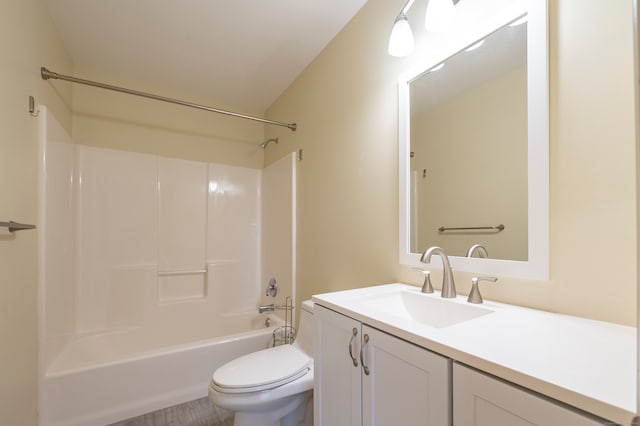 full bathroom featuring bathing tub / shower combination, vanity, and toilet