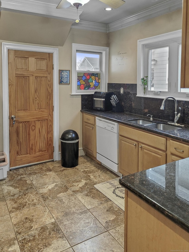 kitchen with ornamental molding, plenty of natural light, white dishwasher, and sink