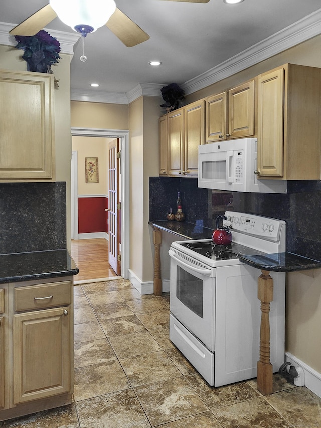 kitchen featuring dark stone counters, decorative backsplash, ornamental molding, ceiling fan, and white appliances