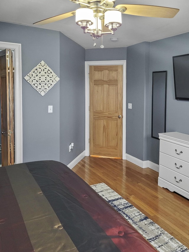 bedroom featuring hardwood / wood-style flooring and ceiling fan