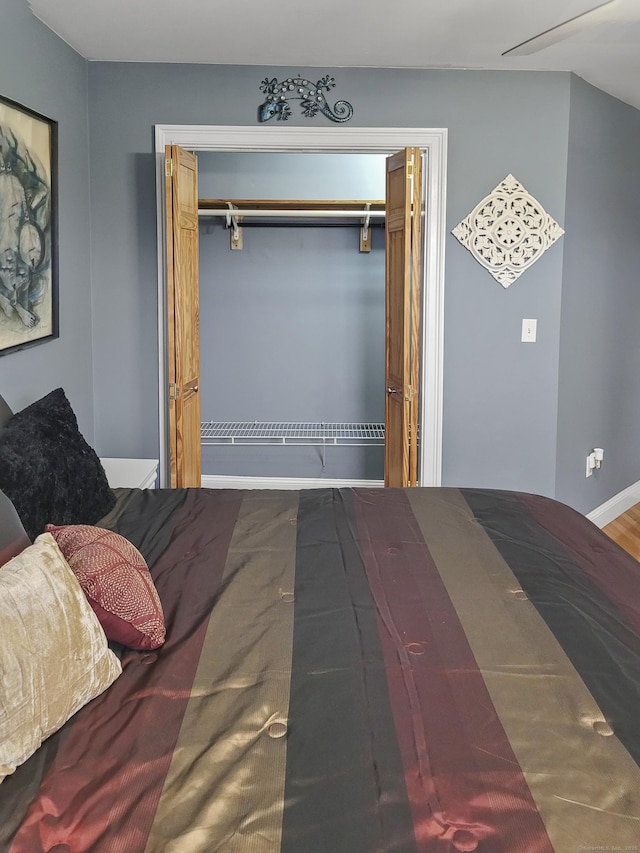 bedroom featuring ceiling fan and a closet