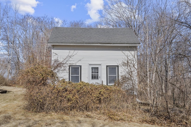 view of home's exterior featuring a shingled roof