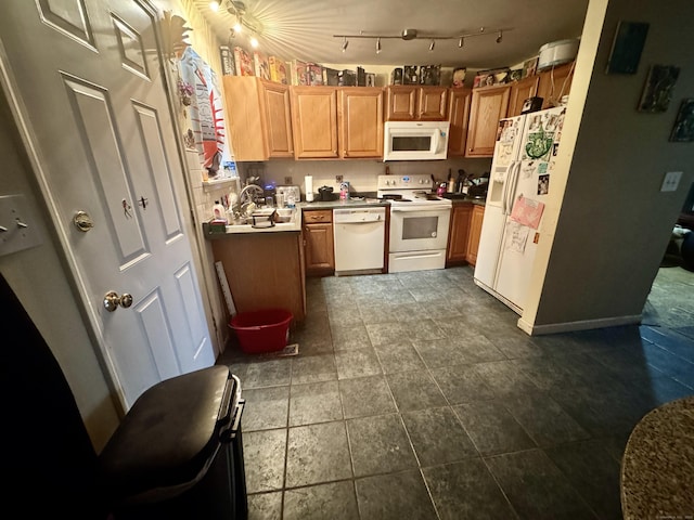 kitchen with sink and white appliances