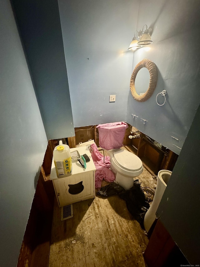 bathroom featuring toilet and hardwood / wood-style floors