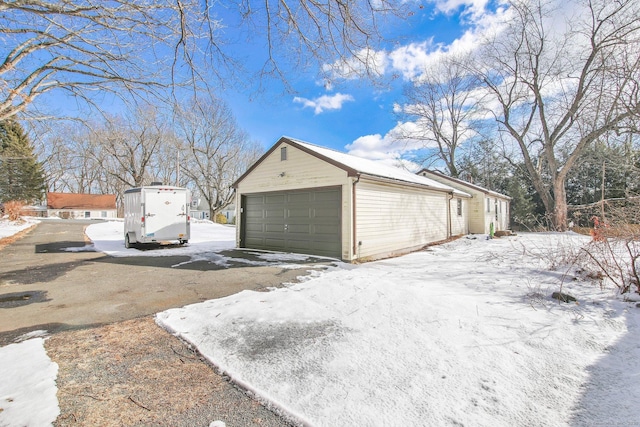 view of snow covered garage