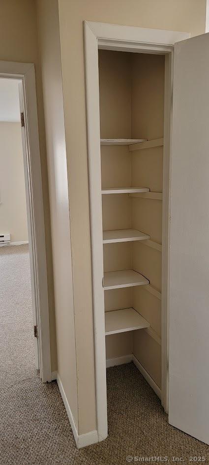 closet featuring a baseboard heating unit