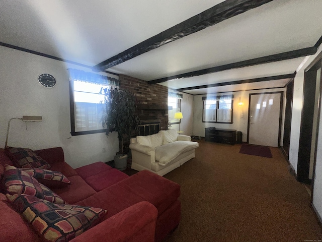 bedroom featuring beamed ceiling, a brick fireplace, carpet, and multiple windows