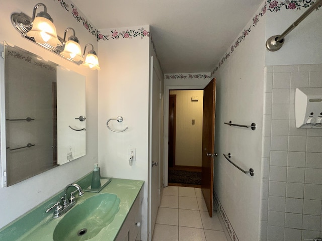 bathroom featuring tile patterned flooring and vanity