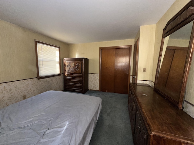 carpeted bedroom with a closet