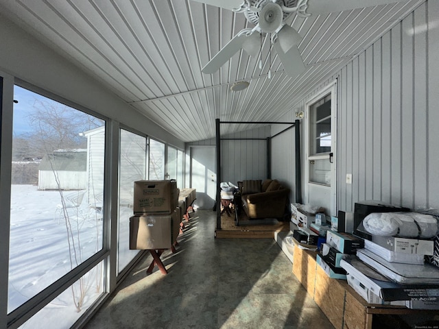 sunroom / solarium featuring ceiling fan