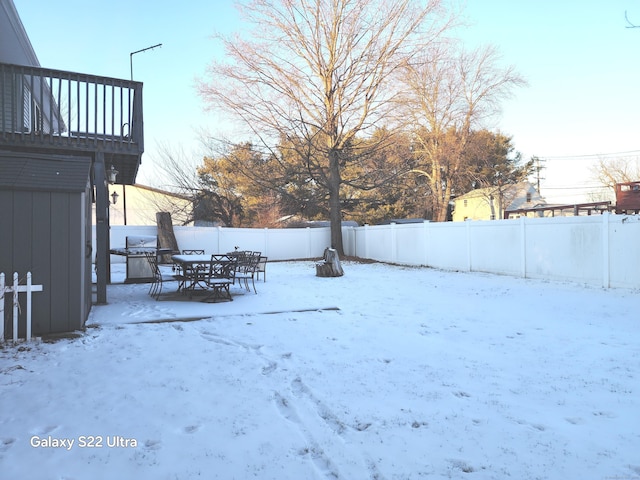 view of yard covered in snow