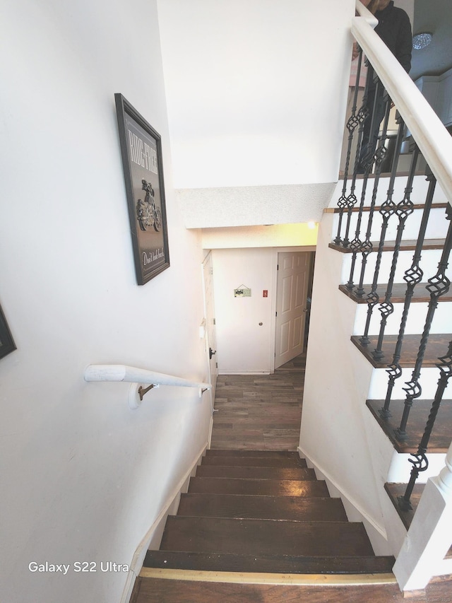 stairway featuring hardwood / wood-style floors