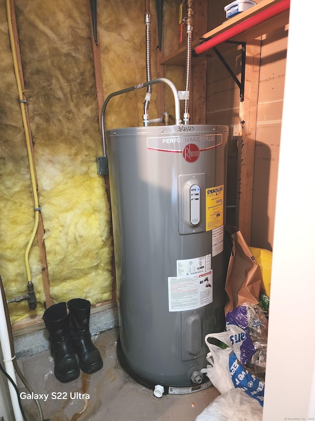 utility room featuring electric water heater