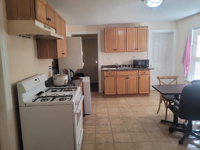 kitchen featuring sink and white appliances