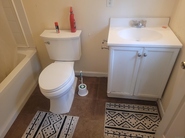 bathroom featuring vanity, toilet, and tile patterned flooring