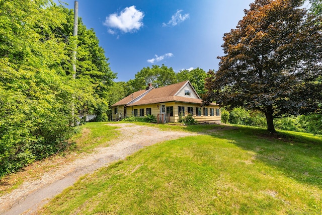108 Fall Mountain Rd, Bristol, CT 06010 - view of front of property featuring dirt driveway, a chimney, and a front lawn
