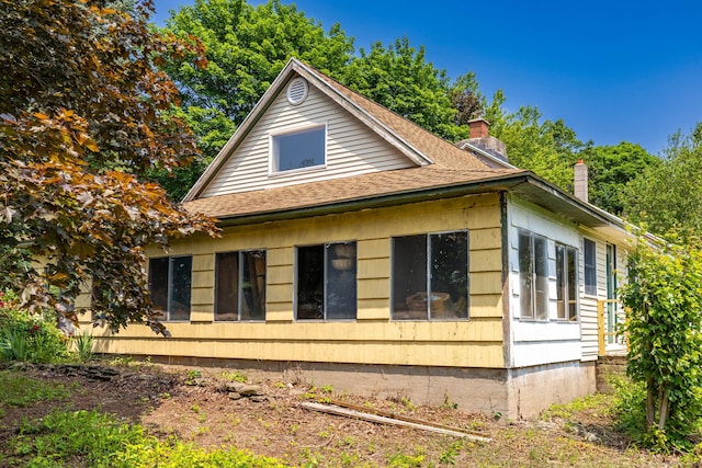 108 Fall Mountain Rd, Bristol, CT 06010 - view of side of home featuring a chimney and a shingled roof