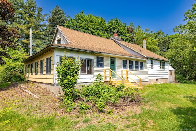 108 Fall Mountain Rd, Bristol, CT 06010 - view of front of house with a chimney, roof with shingles, and a front yard