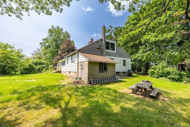 108 Fall Mountain Rd, Bristol, CT 06010 - view of property exterior featuring a chimney and a lawn