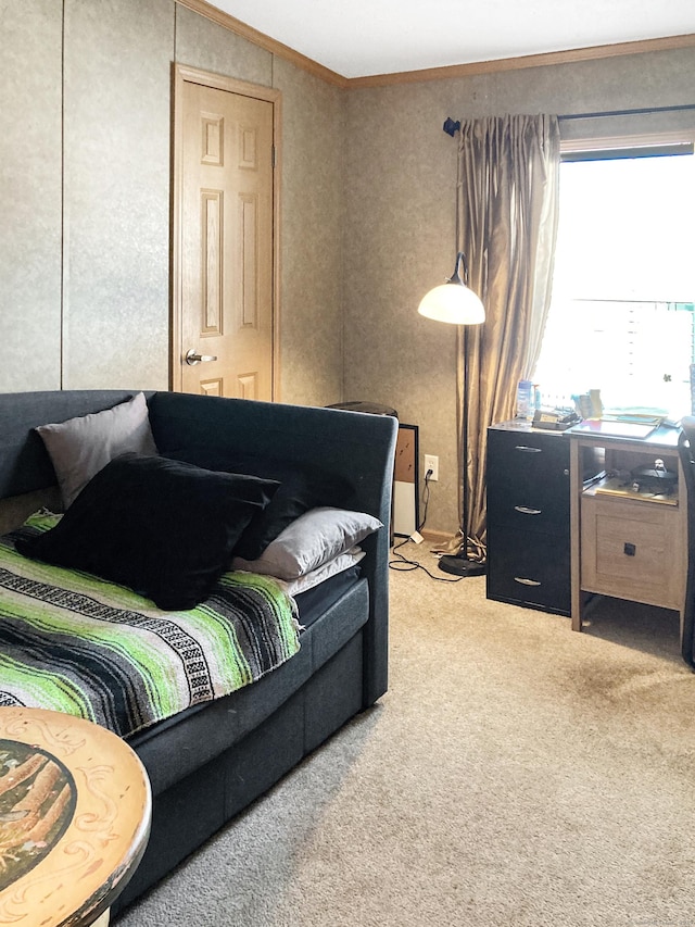 carpeted bedroom featuring crown molding