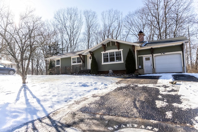 ranch-style home featuring a garage