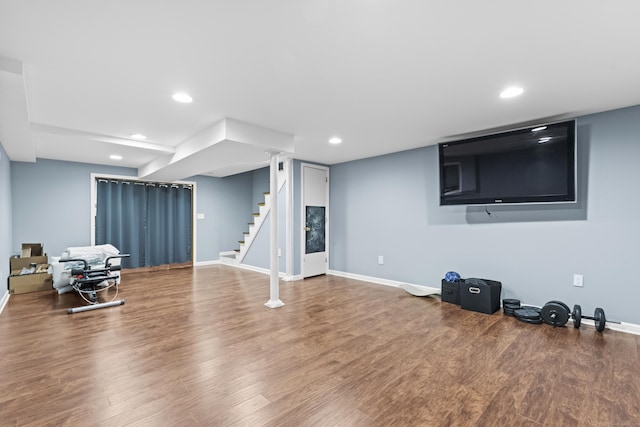 workout area with hardwood / wood-style flooring