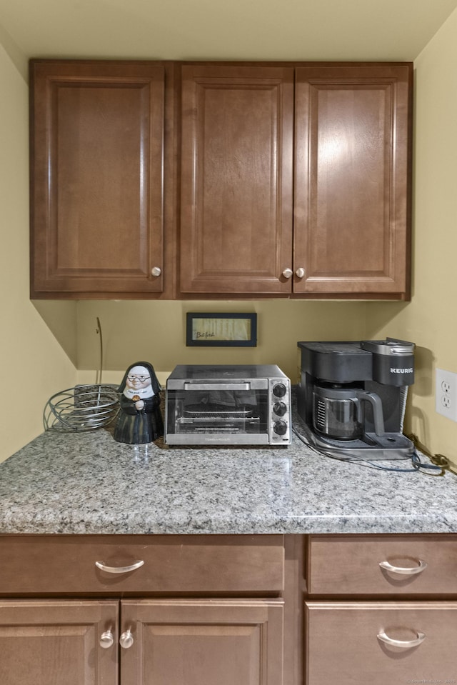 kitchen featuring light stone countertops