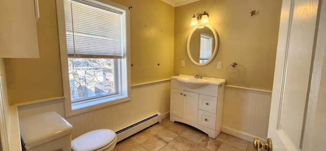 bathroom with vanity, a baseboard heating unit, tile patterned floors, and toilet