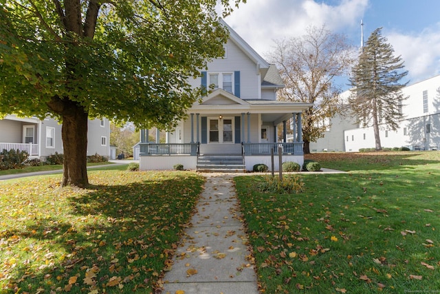 view of front of house with a porch and a front yard