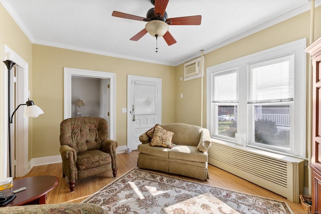 living area featuring ceiling fan, crown molding, light hardwood / wood-style flooring, and a wall mounted AC