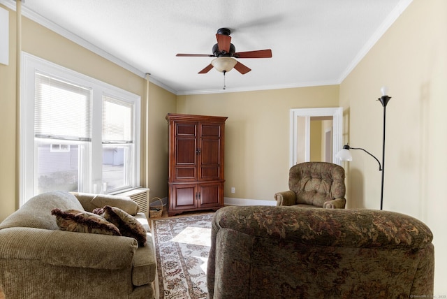 sitting room featuring crown molding and ceiling fan