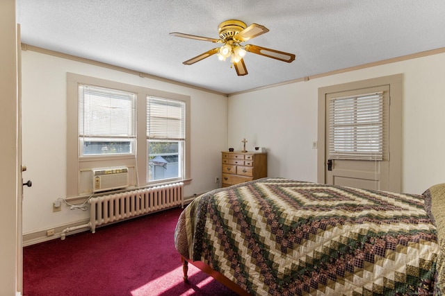 carpeted bedroom featuring radiator heating unit, cooling unit, ceiling fan, crown molding, and a textured ceiling