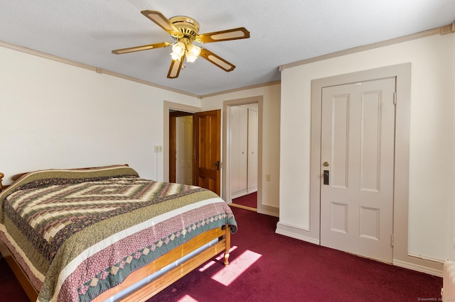 bedroom with dark colored carpet, ornamental molding, a textured ceiling, and ceiling fan