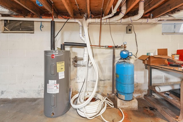 utility room featuring water heater