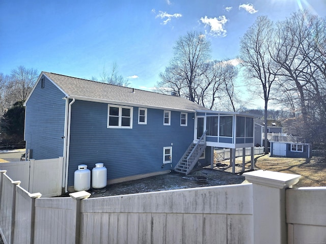 rear view of house with a sunroom