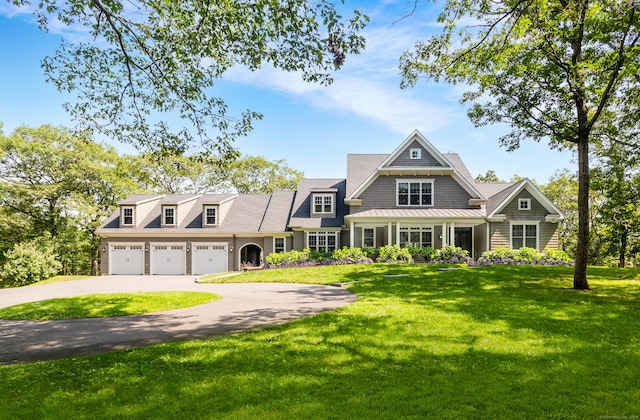 view of front of property featuring a garage and a front yard