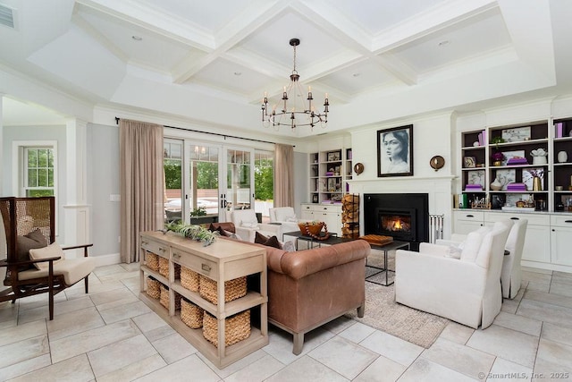 living room featuring built in shelves, coffered ceiling, french doors, and beamed ceiling