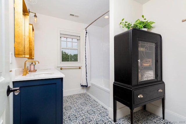 bathroom with shower / tub combo and vanity