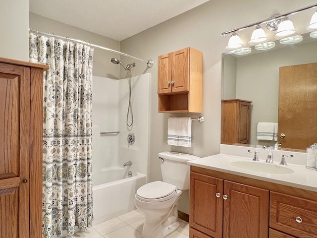 full bathroom with tile patterned flooring, shower / bath combo, vanity, and toilet