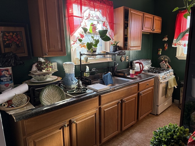 kitchen with white range with gas cooktop