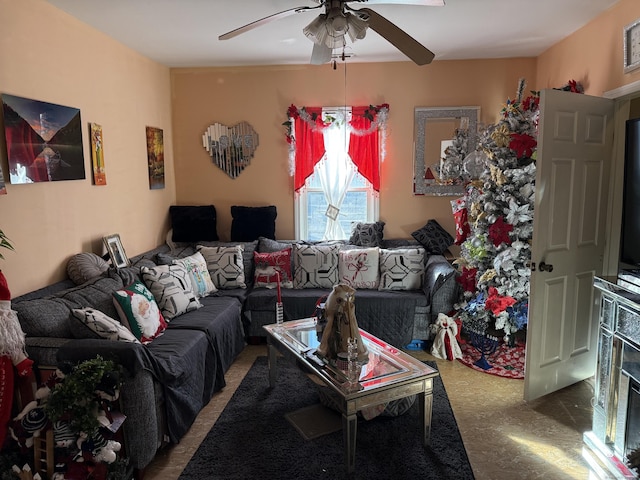 carpeted living room with ceiling fan