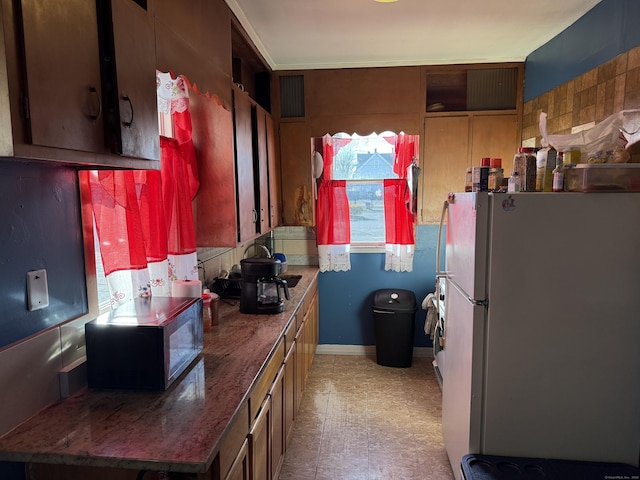 kitchen featuring white fridge