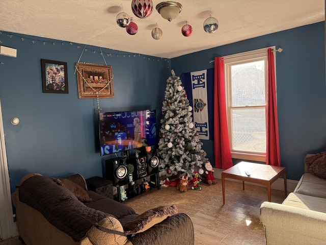 living room with a textured ceiling