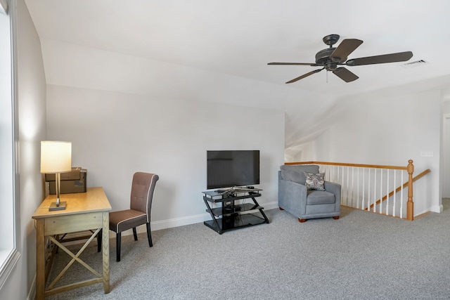 carpeted office space featuring vaulted ceiling and ceiling fan