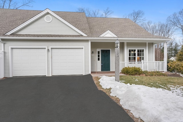 view of front of house with a garage and a porch