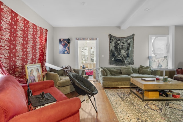 living room featuring hardwood / wood-style floors and beam ceiling