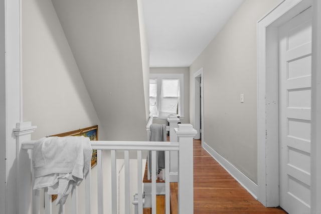 hallway with hardwood / wood-style floors