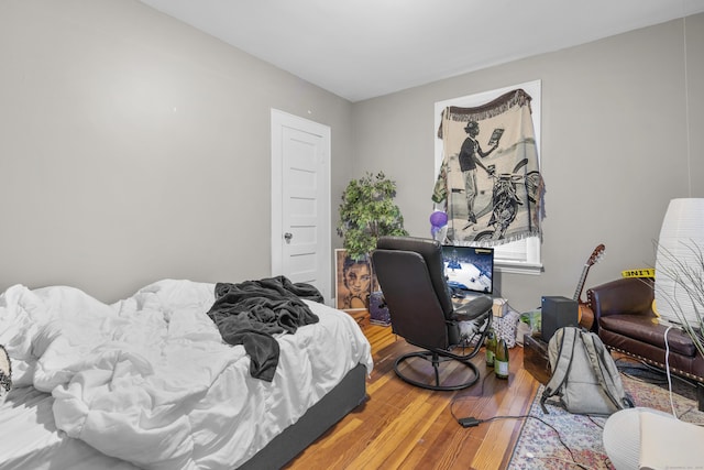 bedroom featuring hardwood / wood-style flooring