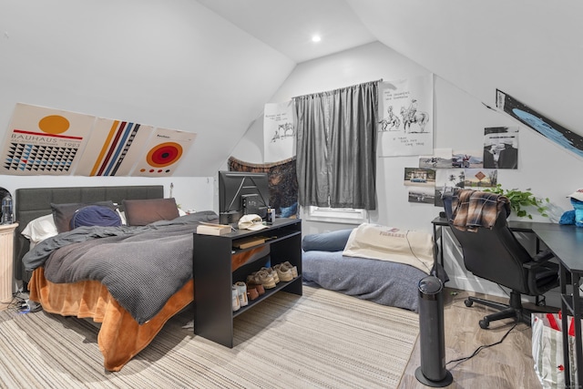 bedroom with lofted ceiling